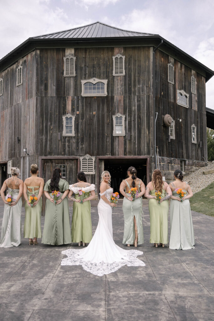 Bridal Party posing in front of a barn