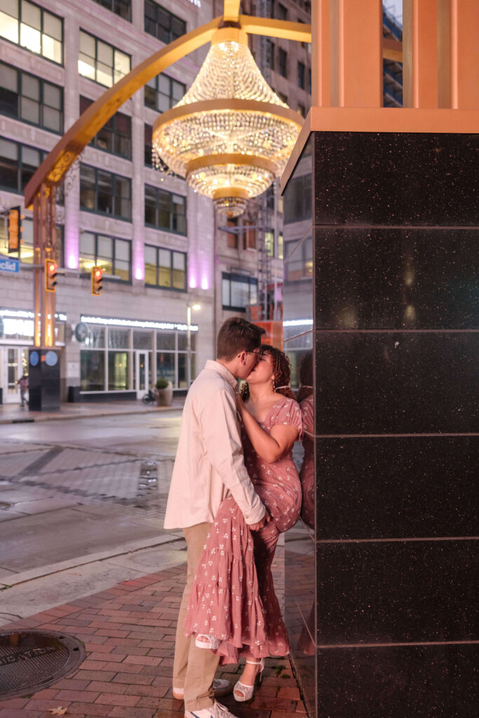 A romantic moment under the chandelier or a fun, urban shot near the theater signs