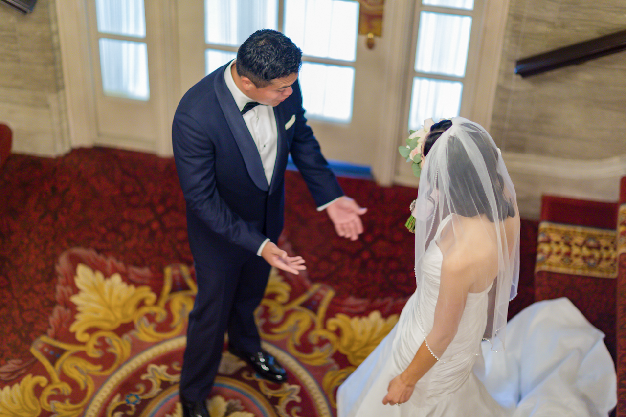 Nicole and Malcolm meeting on the staircase